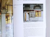 a book opened to show a picture of a church