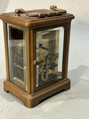 a small clock that is sitting on a table
