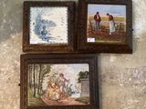 three framed pictures hanging on the wall of a room