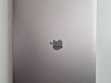 a silver laptop with an apple logo on the screen