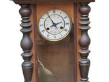 a clock that is hanging on the wall on the wall