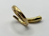 a close up of a gold ring on a white surface