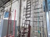 many ladders that are leaning against the wall