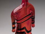 an image of a red glass sculpture of a man