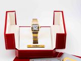 a red box with a gold watch inside of it