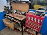 a workbench with tools on it in a garage