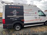 a van that is parked on the side of the road