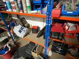 a lot of tools on the shelves in the garage