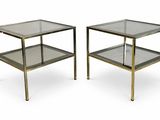 pair of brass and glass side tables with glass shelves
