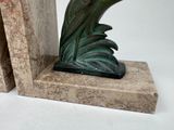 two bookends with a bird on top of them