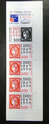 a stamp with a picture of a woman on it on a table