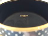 a close up of a coffee cup with polka dots on it