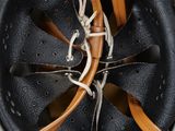a close up of a baseball glove with a ball inside of it