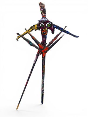 a metal sculpture of a man with skis on his legs