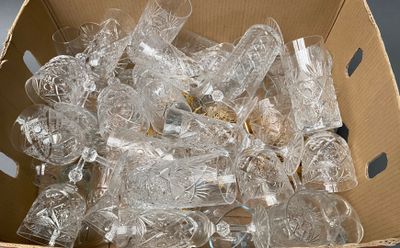 a cardboard box filled with clear plastic bottles