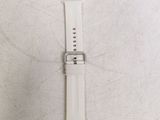 the white strap is attached to the watch face