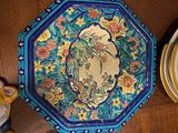 many plates that are sitting on a wooden table