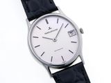 an image of a close up of a wrist watch on a white surface