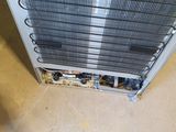 an air conditioner sitting on the floor in a room