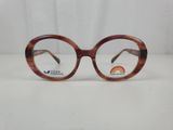 a close up of a pair of glasses on a white surface