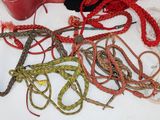 a lot of rope and a pair of scissors on a table