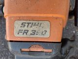 a close up of a small machine with a sticker on it ' s side