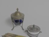 an image of a silver and blue candle holder and a set of matchesticks