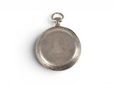 a small silver pocket watch on a white surface