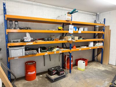 a garage with a lot of shelves and tools on it