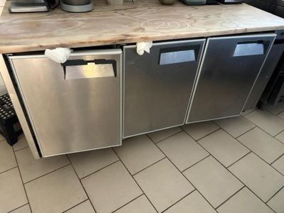 a kitchen with a counter and a dishwasher in it
