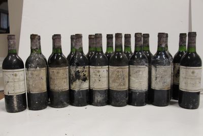 several bottles of wine are lined up in a row on a table