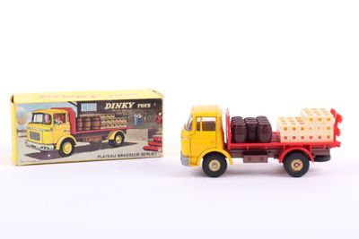 yellow and red toy truck with a box on the back of it