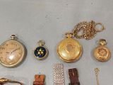 many different types of watches and bracelets on the table