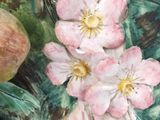 a painting of pink flowers and a pear on a table