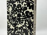 a book with a black and white design on it