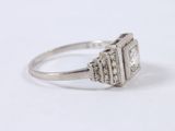 an image of a diamond ring on a white surface