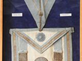 an image of a framed picture of a masonic apron and sash