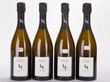 trois bouteilles de vin posées l'une à côté de l'autre sur une table