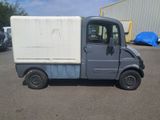 an image of a small truck parked in a parking lot