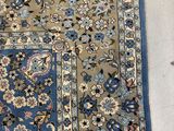 an oriental rug on the floor with a tag on it