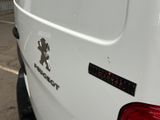 a white van with a mickey mouse sticker on it