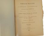 an old book opened to show the title of a french translation