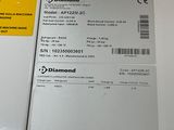 a white box with a label on it next to a white box with a yellow sticker on it