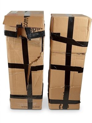pair of cardboard boxes with black tape wrapped around them on a white surface