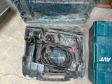 a blue tool box with tools in it sitting on the floor