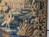 an image of a tapestry hanging on a wall in a room