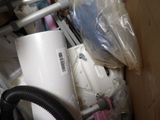 a pile of assorted items in a cardboard box