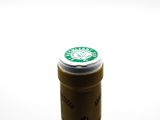 a close up of a bottle of wine on a table