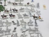a lot of toy figurines that are on the table