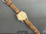 someone is taking a picture of a watch with their cell phone